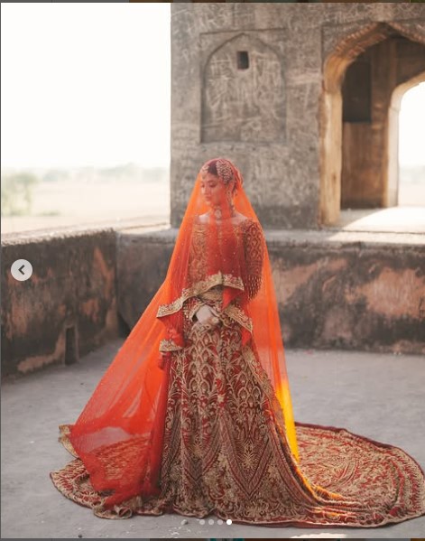 Red bridal lehenga with trail