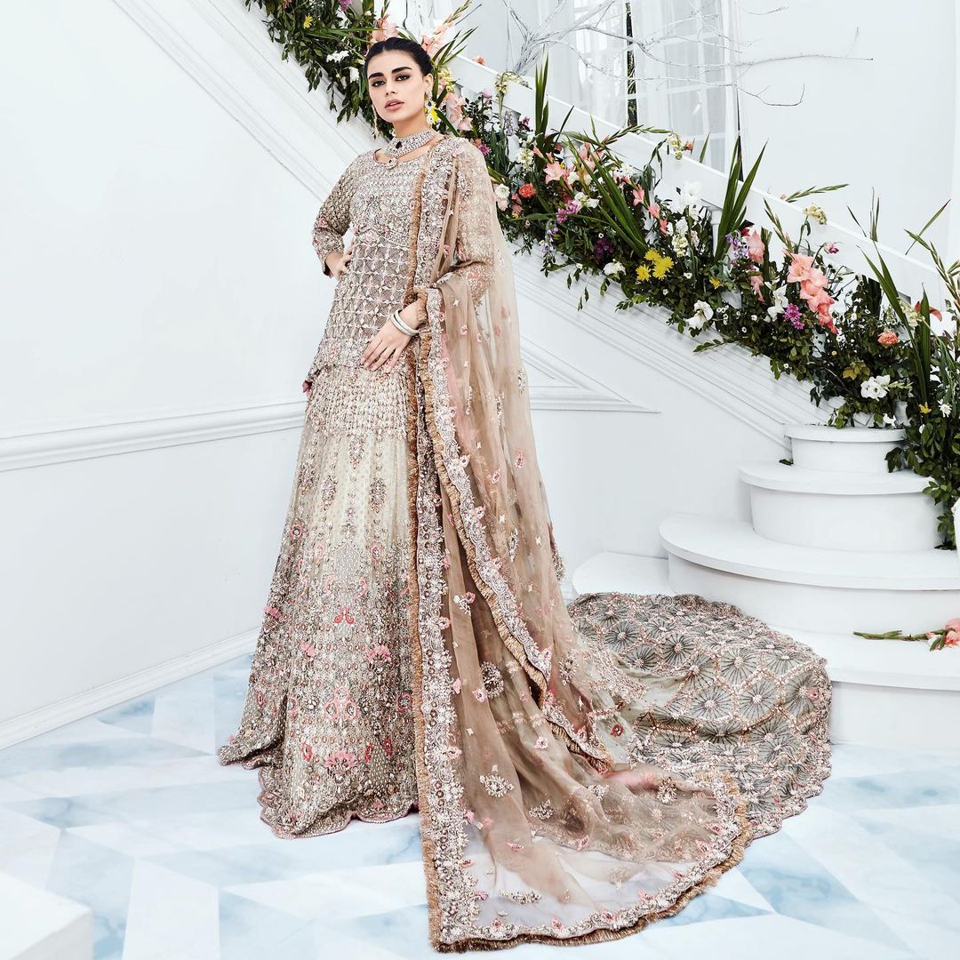 Pakistani Wedding Waleema long Trail Lehenga with Peplum and Embellishment - DN-1496