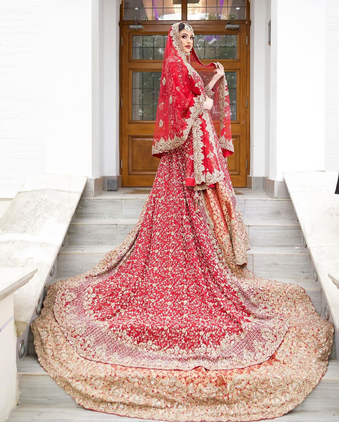 TRADITIONAL RED LONG TRAIL WEDDING LEHENGA WITH GOLDEN EMBROIDERY - DN-1914